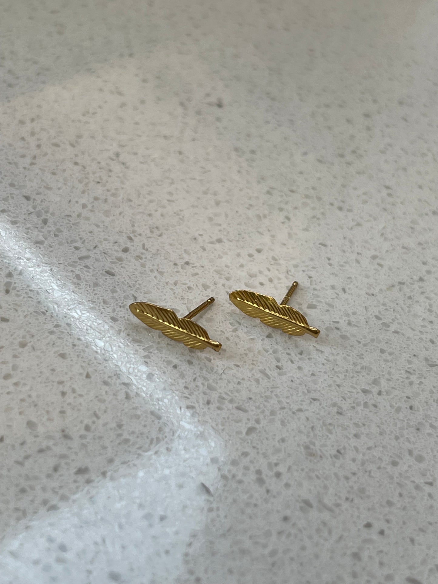 Feather studs