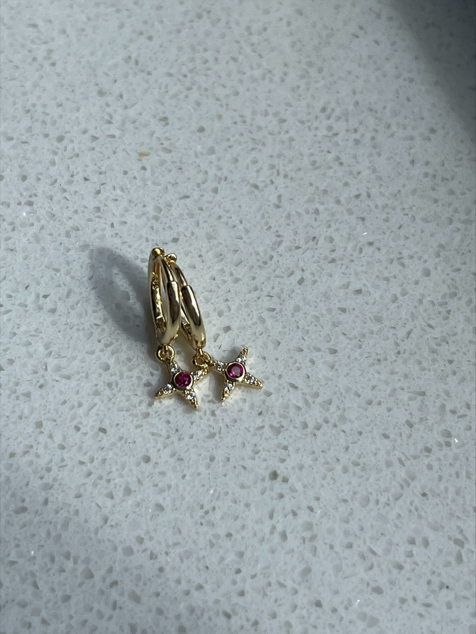Ster hanger met roze steen