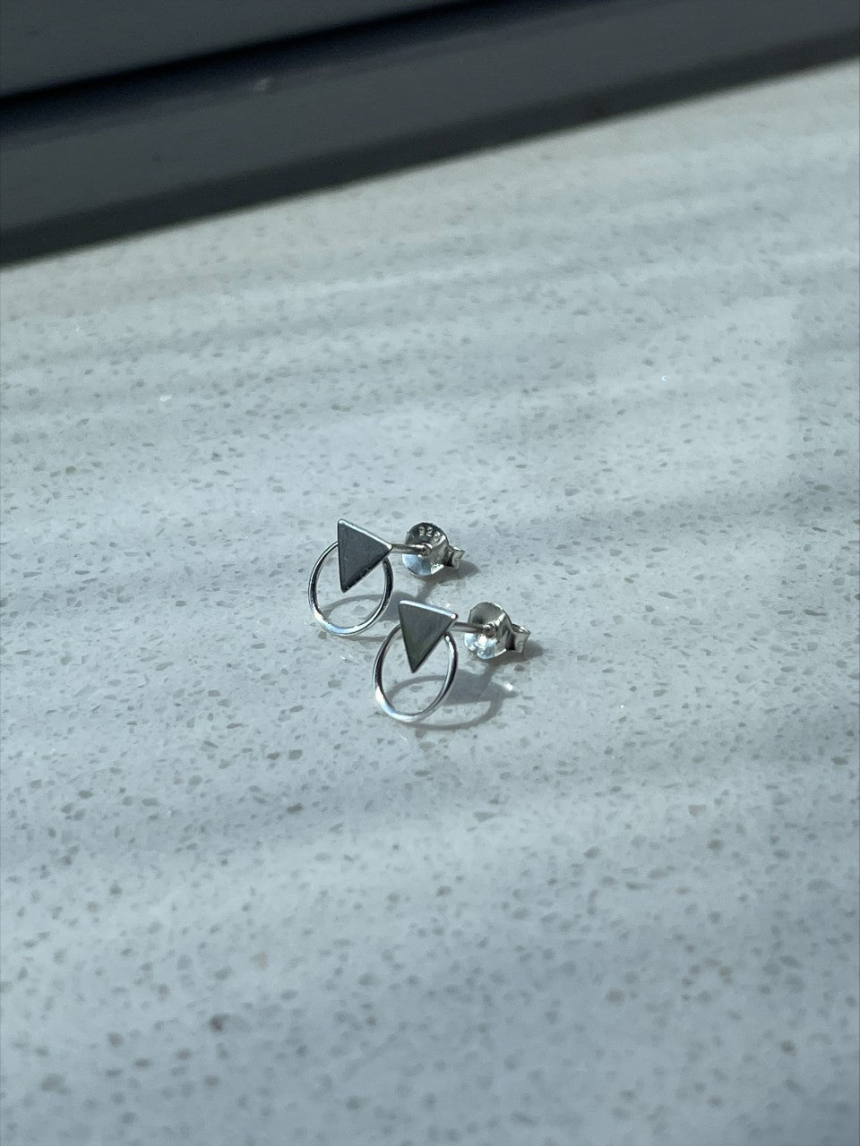 Triangle in round studs
